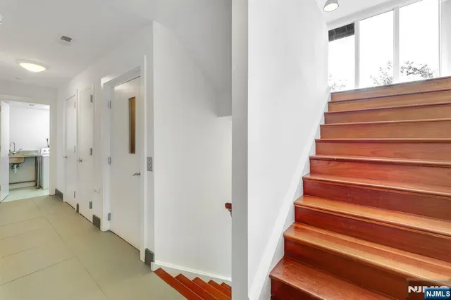 a view of wooden floor and windows in a room