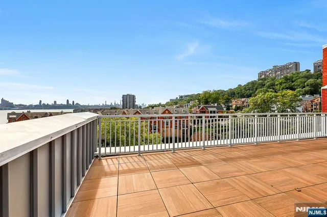 a view of swimming pool from a balcony