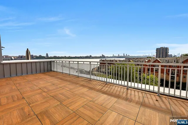 a view of a lake with building in front of it
