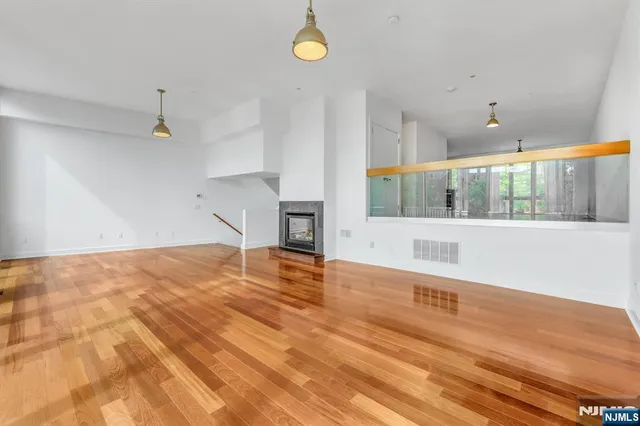a view of a porch with wooden floor and windows