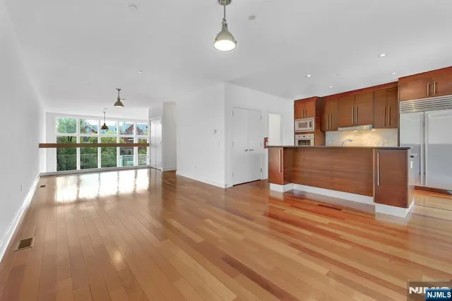 a view of a living room with furniture and a fireplace