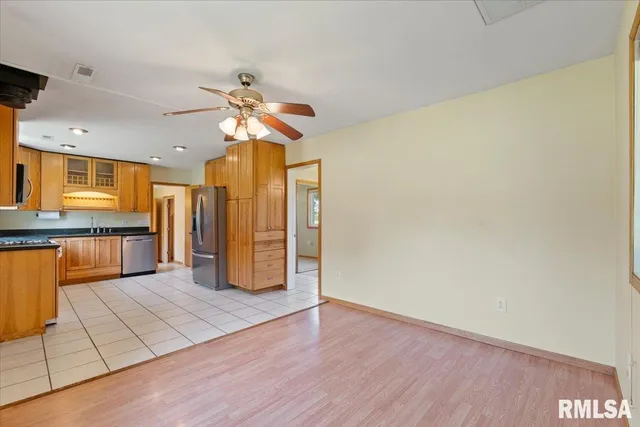 a view of a kitchen with a sink and a kitchen counter top space