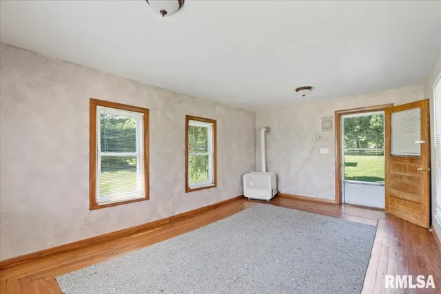 a bedroom with furniture and windows