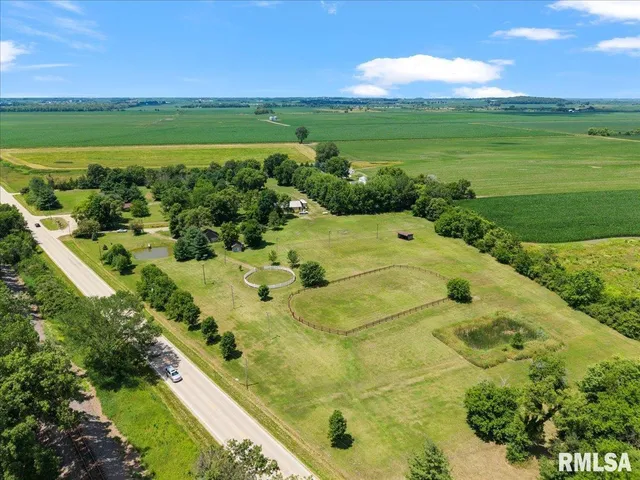 a view of a swimming pool with a yard