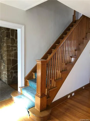 a view of entryway with wooden floor