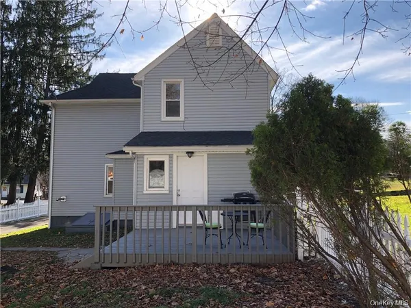 a front view of a house with yard