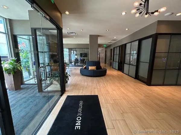 a large bedroom with wooden floor