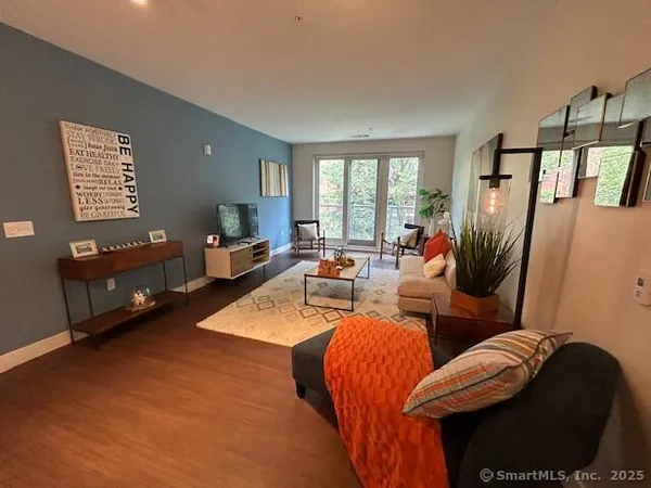 a living room with furniture and a large window