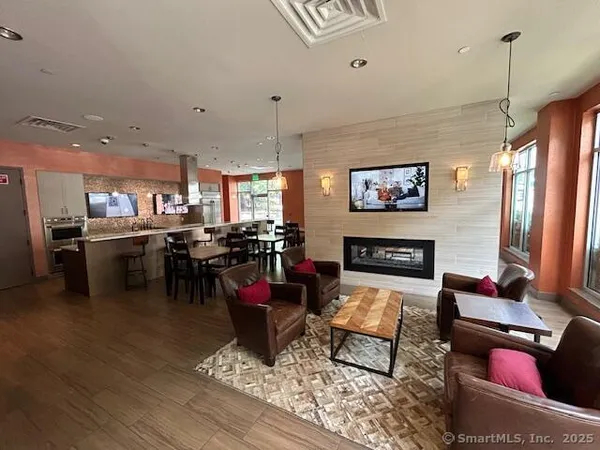 a living room with furniture and kitchen view