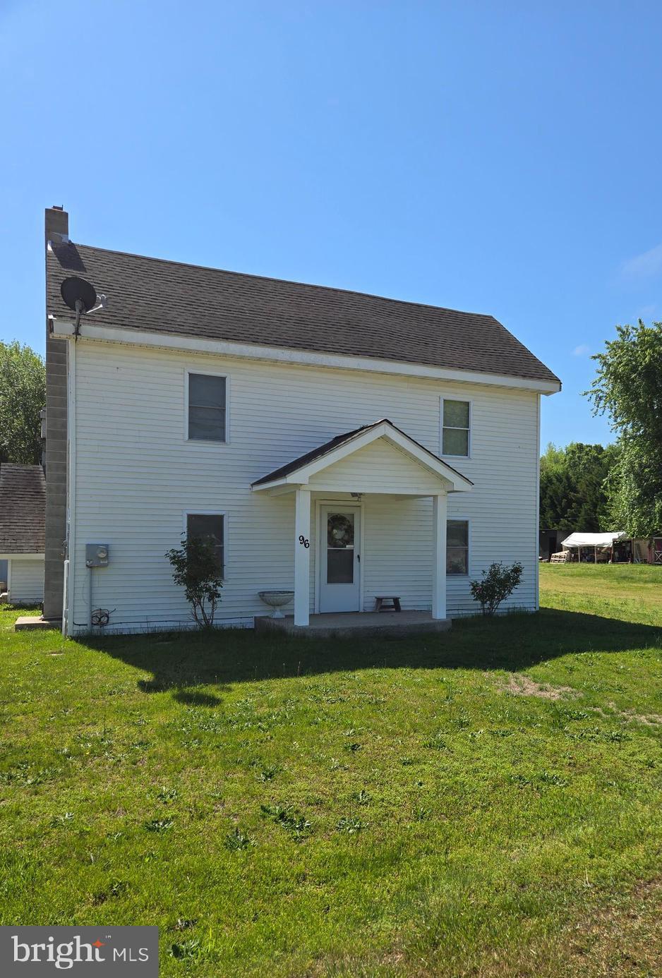 96 Main Street Heislerville, NJ 08324 - Photo 1 of 14 a front view of house with yard and trees in the background