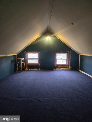 a view of empty room with a fireplace