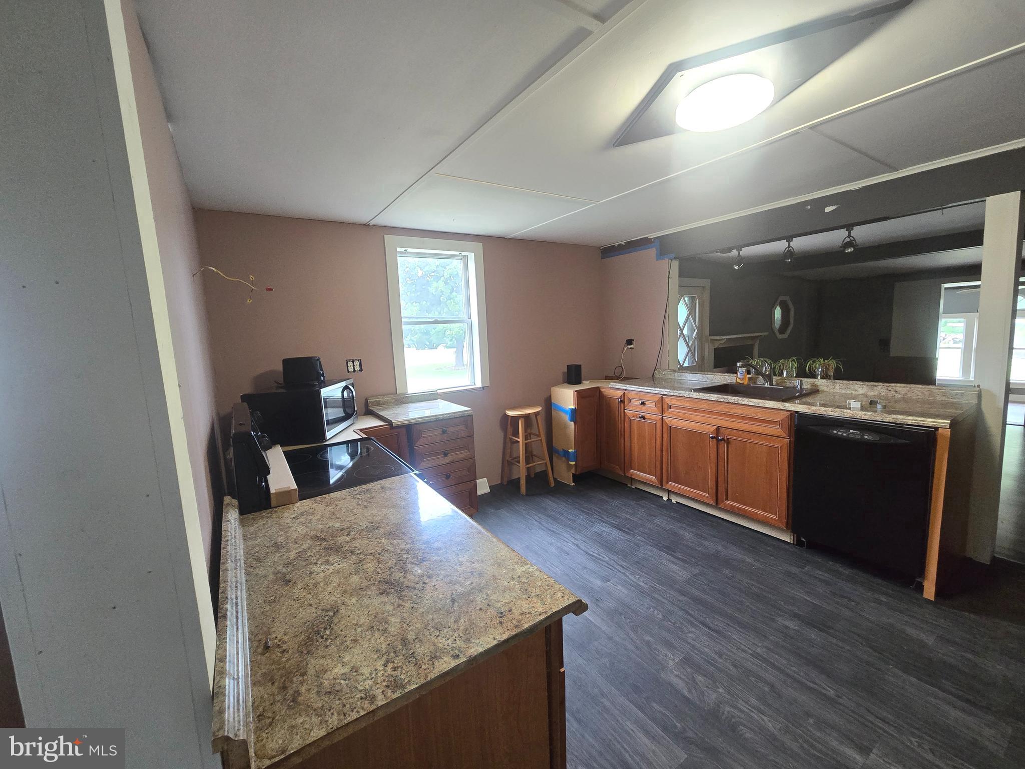 96 Main Street Heislerville, NJ 08324 - Photo 3 of 14 a view of a kitchen with sink cabinets and wooden floor