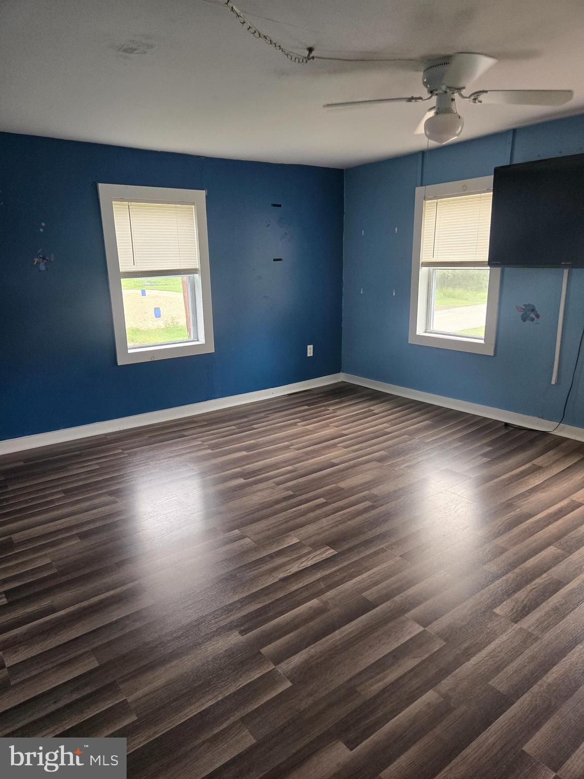 96 Main Street Heislerville, NJ 08324 - Photo 4 of 14 an empty room with wooden floor and windows