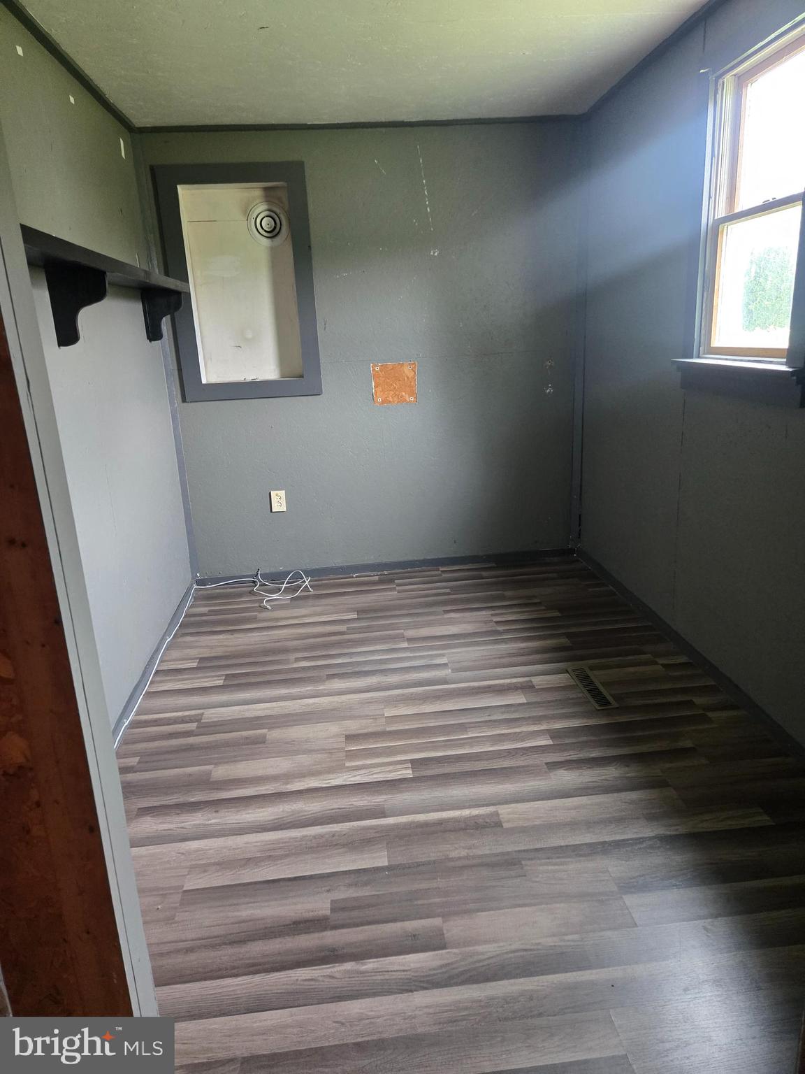 96 Main Street Heislerville, NJ 08324 - Photo 6 of 14 a view of a hallway with wooden floor and staircase