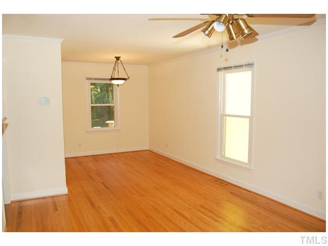 3317 Octavia Street Raleigh, NC 27606 - Photo 3 of 25 The open living and dining areas are wrapped with crown moulding and greet you with warm hardwood floors that carry throughout most of the home.
