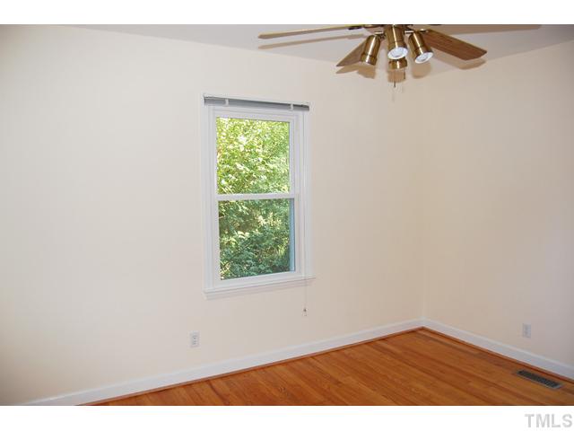 3317 Octavia Street Raleigh, NC 27606 - Photo 9 of 25 Sleep well in the master suite that offers a walk-in closet and a skylight.