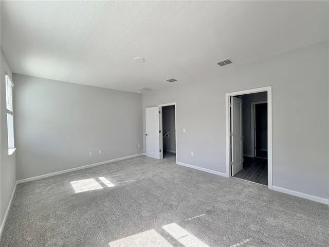 a bathroom with a double vanity sink and mirror