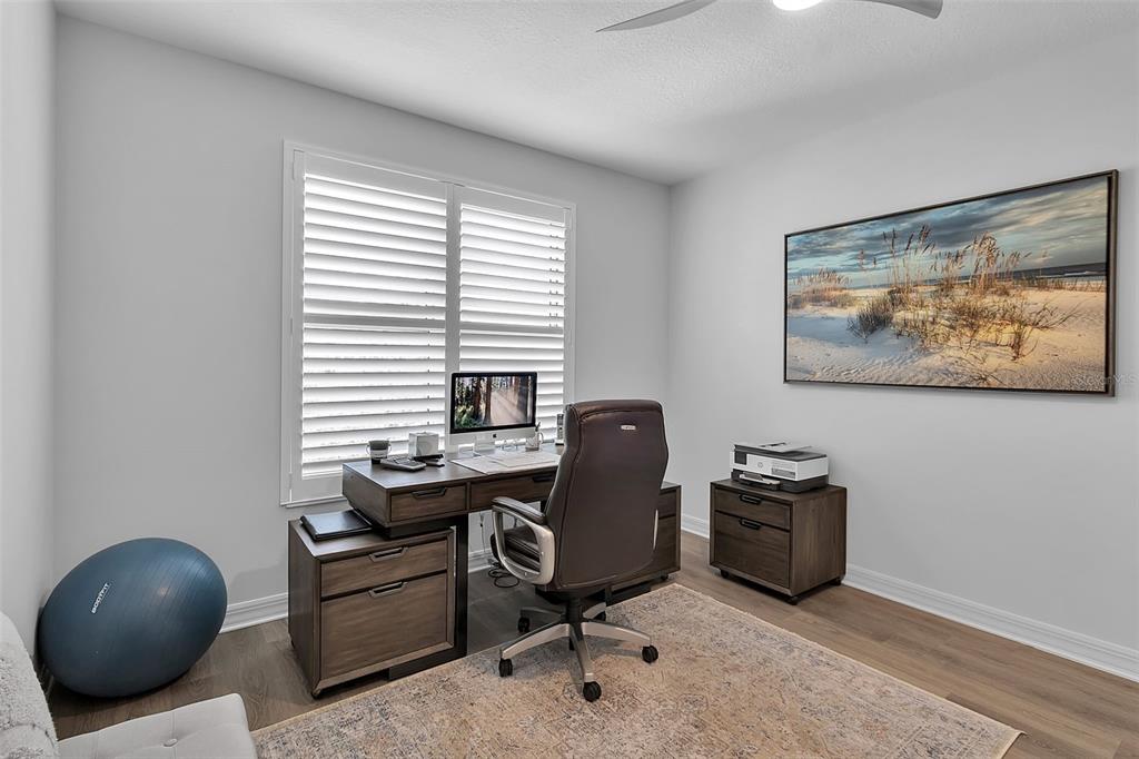 393 North Point Road, Unit 401 Osprey, FL 34229 - Photo 40 of 62 a view of a workspace with furniture and a window