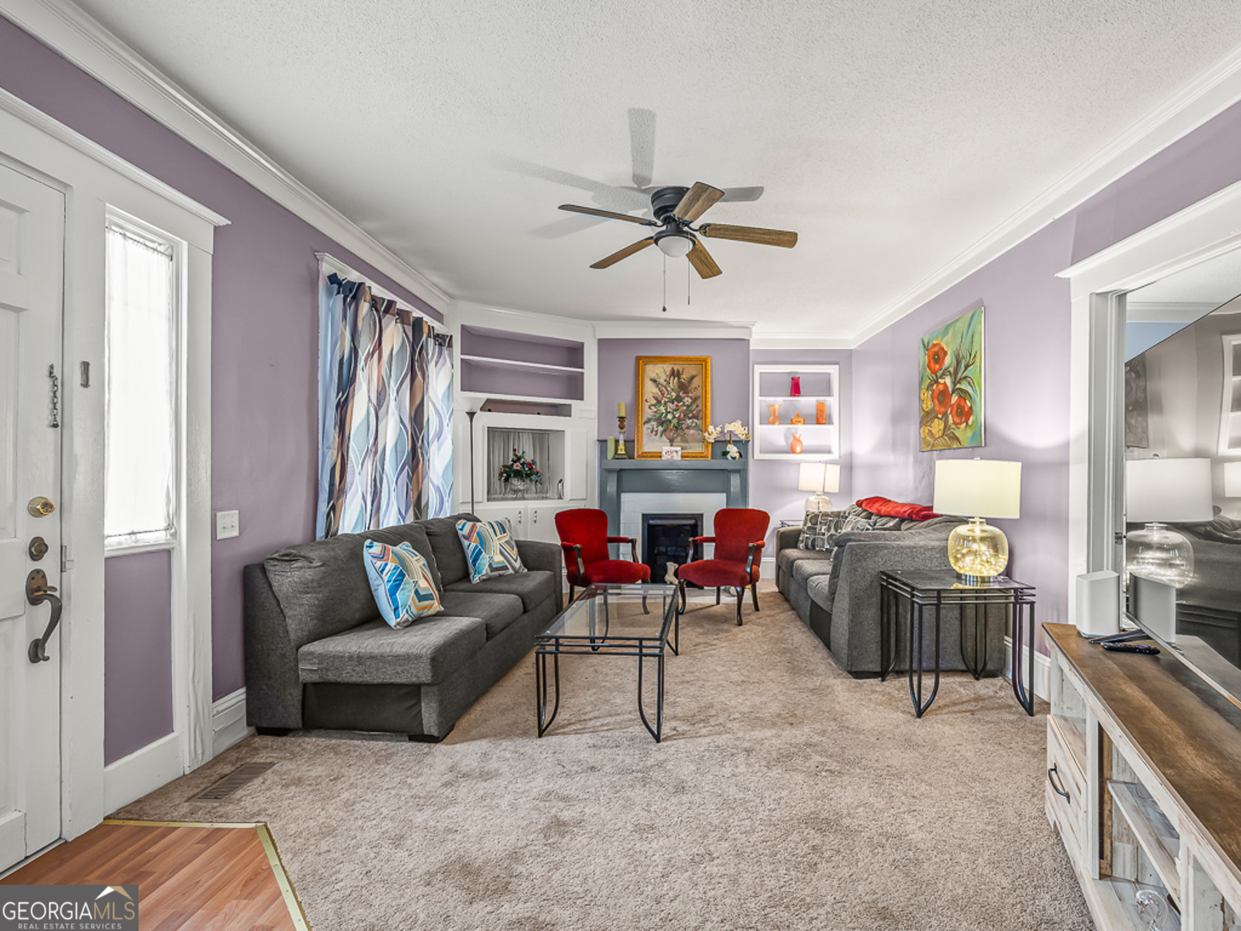 517 North Masonic Street Millen, GA 30442 - Photo 12 of 40 a living room with furniture and a flat screen tv