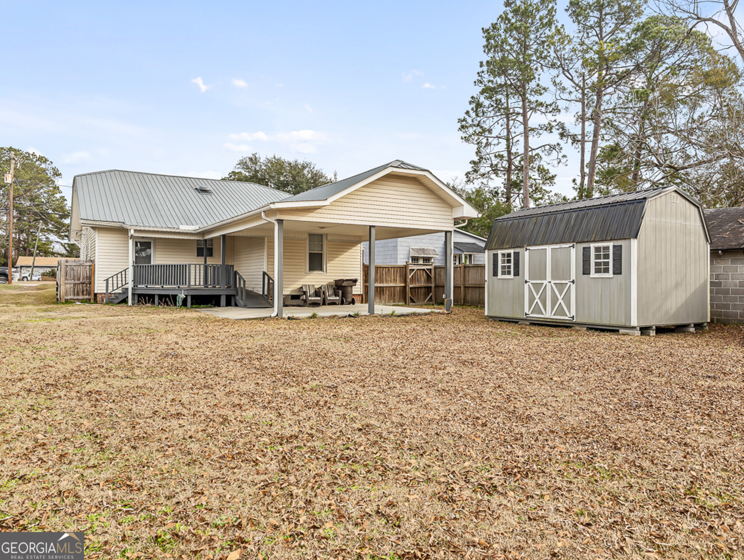 517 North Masonic Street Millen, GA 30442 - Photo 40 of 40 a front view of a house with a yard