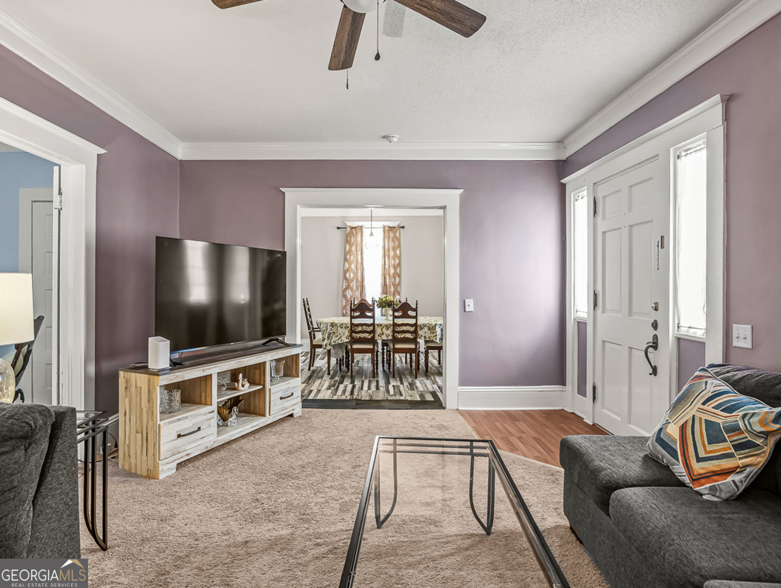 517 North Masonic Street Millen, GA 30442 - Photo 8 of 40 a living room with furniture and a flat screen tv
