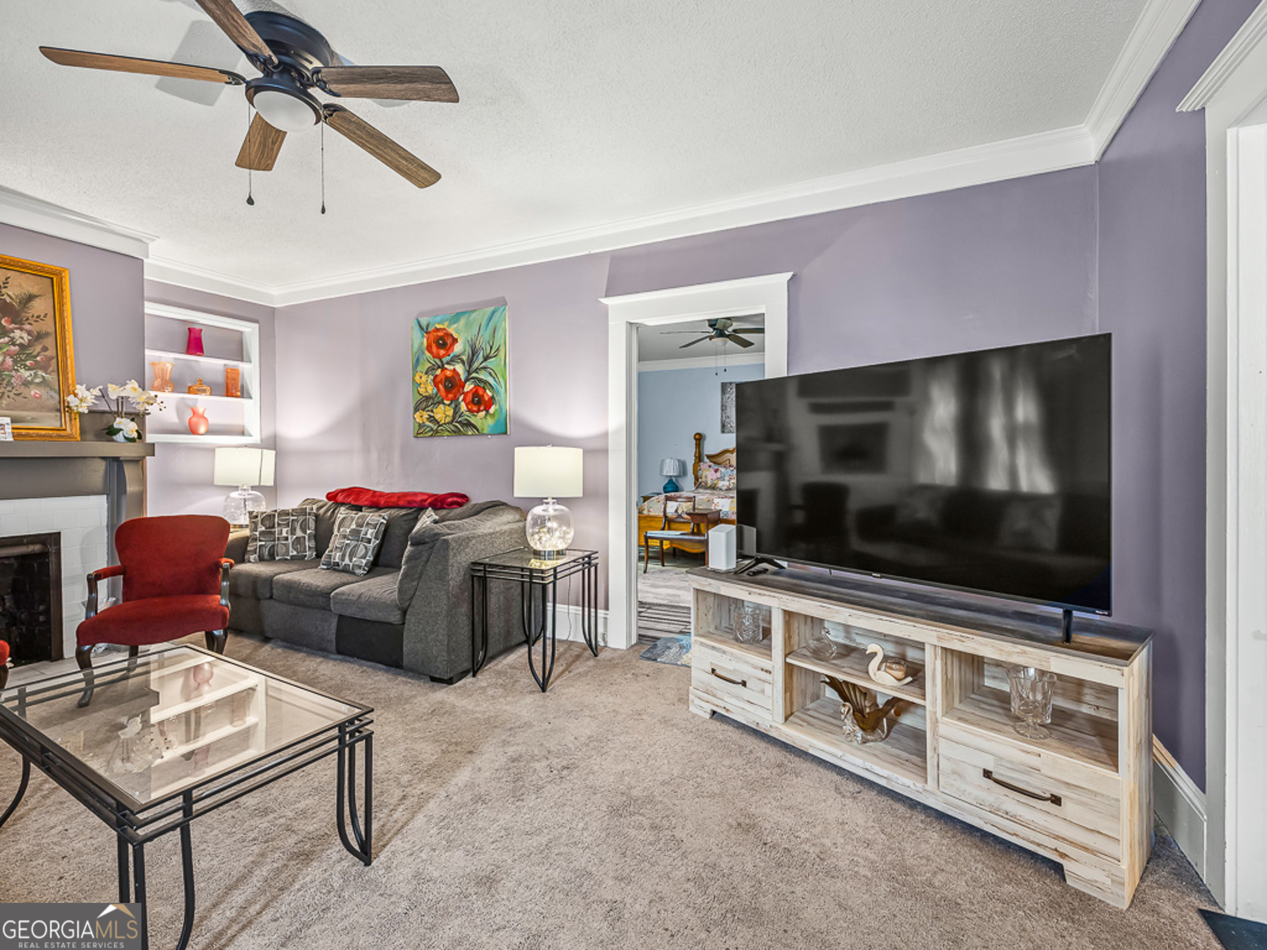 517 North Masonic Street Millen, GA 30442 - Photo 10 of 40 a living room with furniture and a flat screen tv