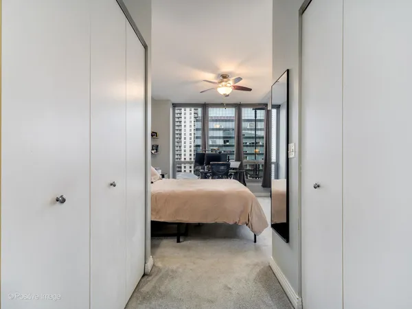 a bed room with a bed and a window