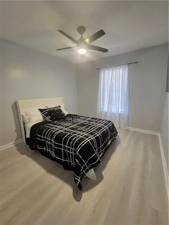 a bedroom with a bed and window