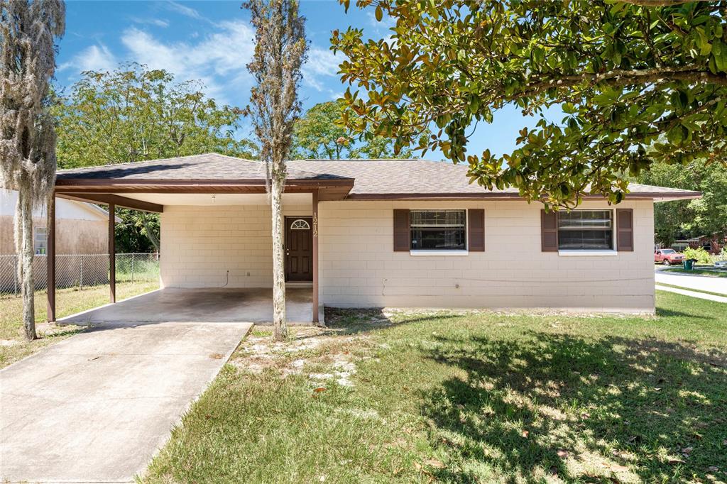 1212 Wall Street Eustis, FL 32726 - Photo 1 of 1 front view of a house with a yard