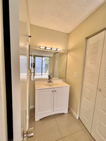 a bathroom with a double vanity sink and mirror