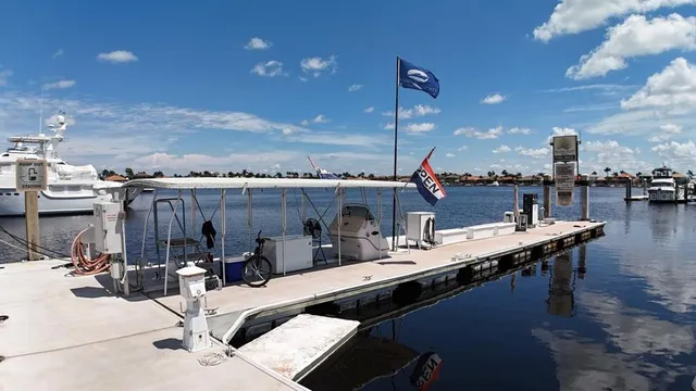 an aerial view of a city with lots of residential buildings and lake view