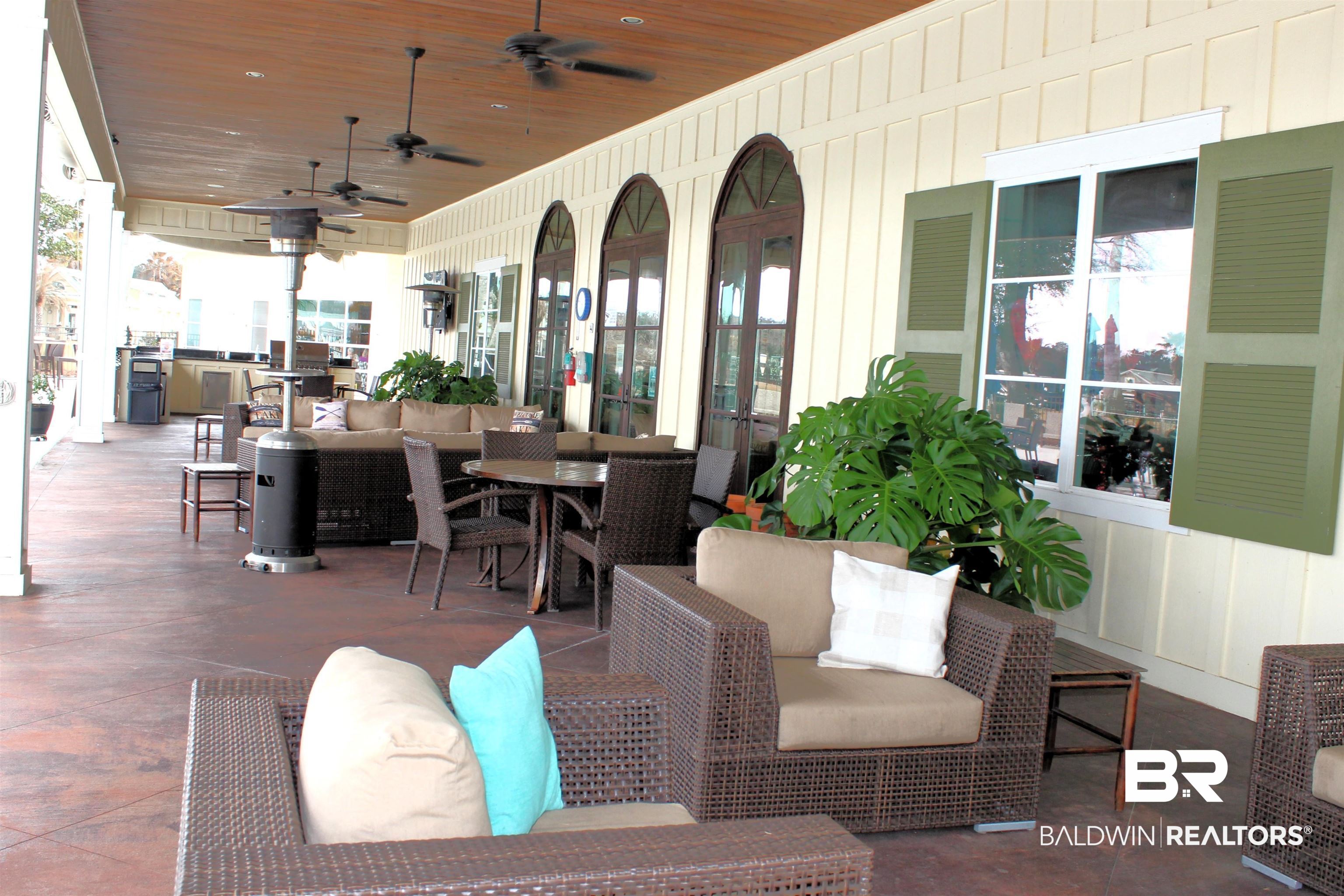 28152 Migratory Way Elberta, AL 36530 - Photo 31 of 54 View of patio with an outdoor hangout area, outdoor dining space, and a ceiling fan