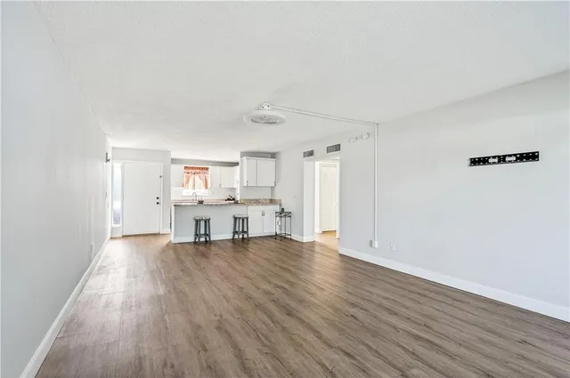 a view of a livingroom with wooden floor