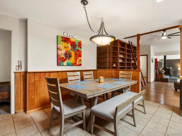 a dining room with a table and chairs