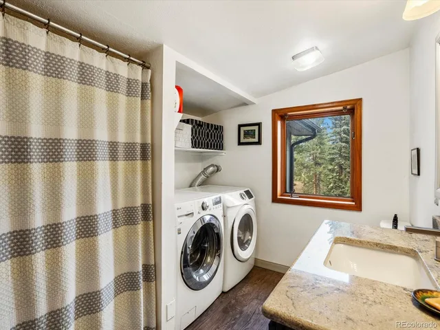 a view of a bedroom with washer and dryer