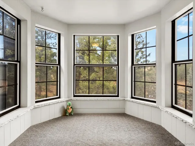 an empty room with windows and windows