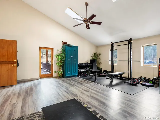 a view of a livingroom with workspace and a window