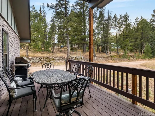 a view of a balcony with furniture