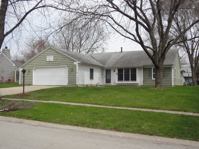 57 Stratford Road Montgomery, IL 60538 - Photo 1 of 15 a front view of a house with a garden and yard