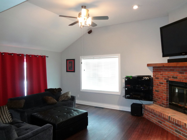 57 Stratford Road Montgomery, IL 60538 - Photo 5 of 15 a living room with furniture a flat screen tv and a fireplace