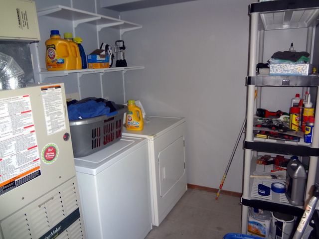 57 Stratford Road Montgomery, IL 60538 - Photo 9 of 15 a utility room with fridge dryer and washer