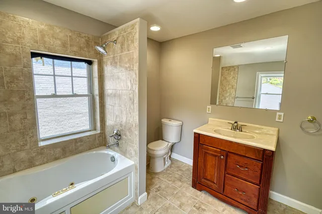 a view of a hallway with washer and dryer