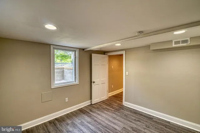 a bathroom with a toilet a sink and a mirror