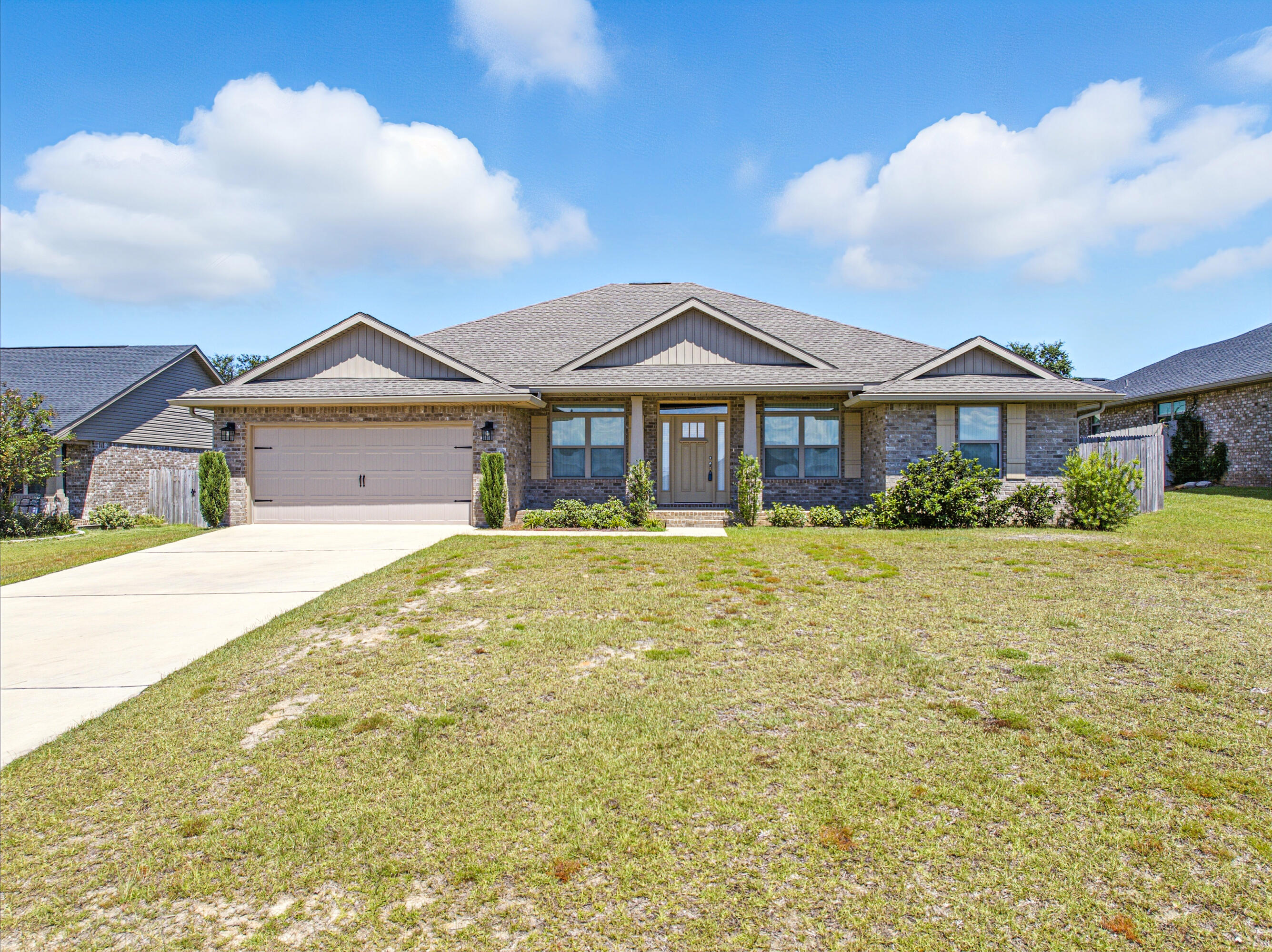 2004 Broad Street Crestview, FL 32536 - Photo 2 of 46 a front view of a house with a garden