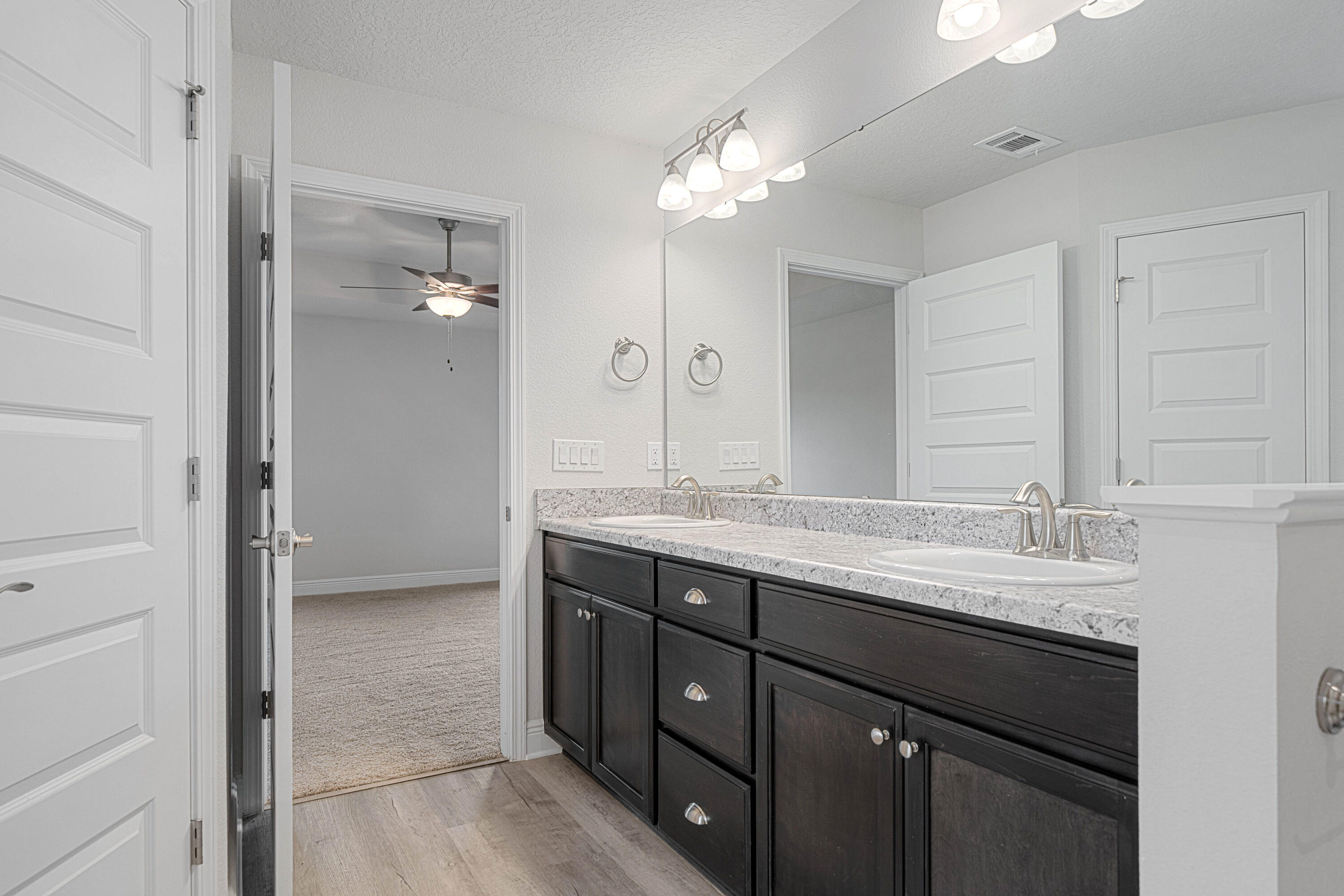 2004 Broad Street Crestview, FL 32536 - Photo 24 of 46 a bathroom with a double vanity sink and a mirror