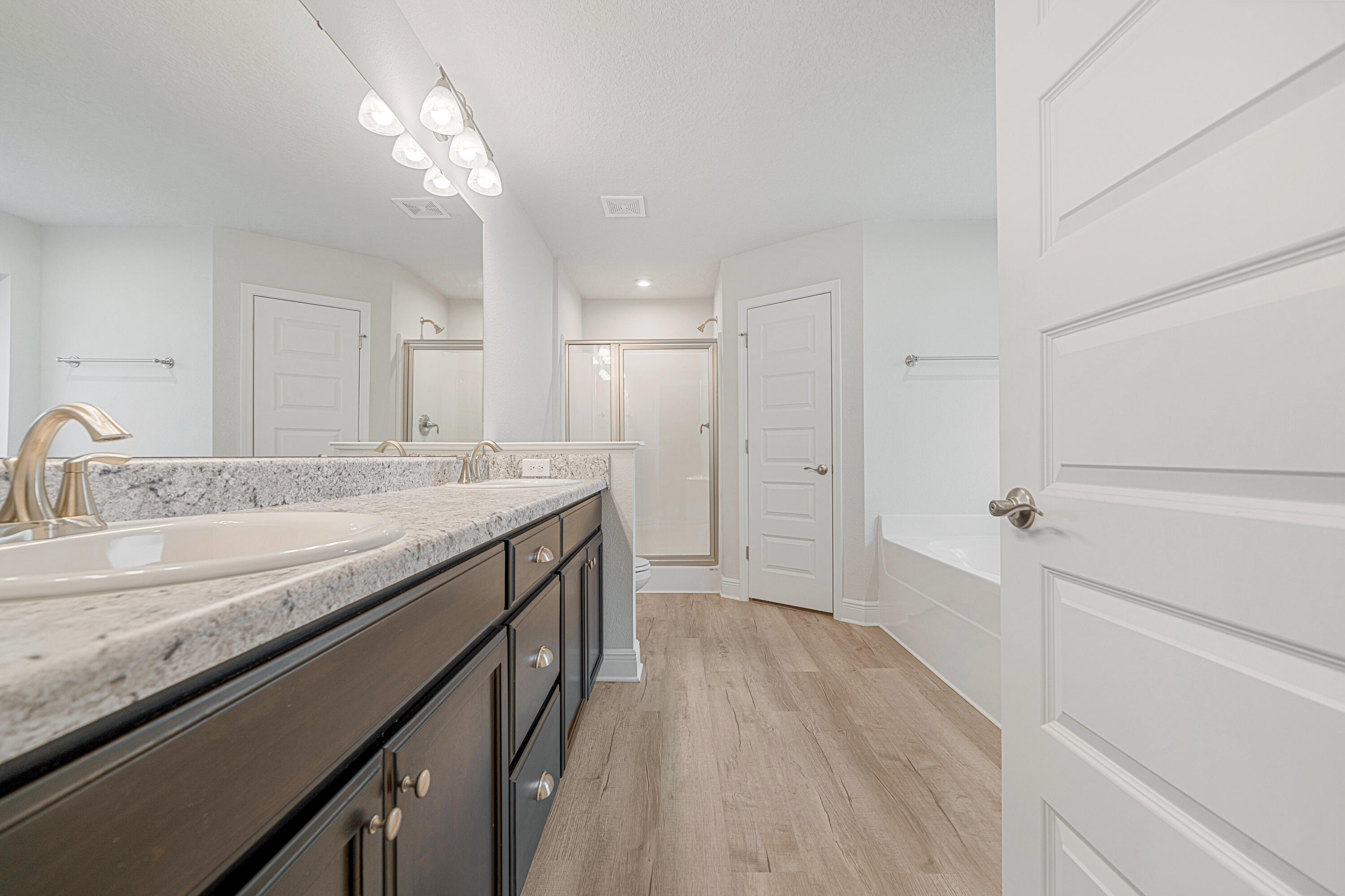 2004 Broad Street Crestview, FL 32536 - Photo 25 of 46 a bathroom with a granite countertop sink a mirror and shower
