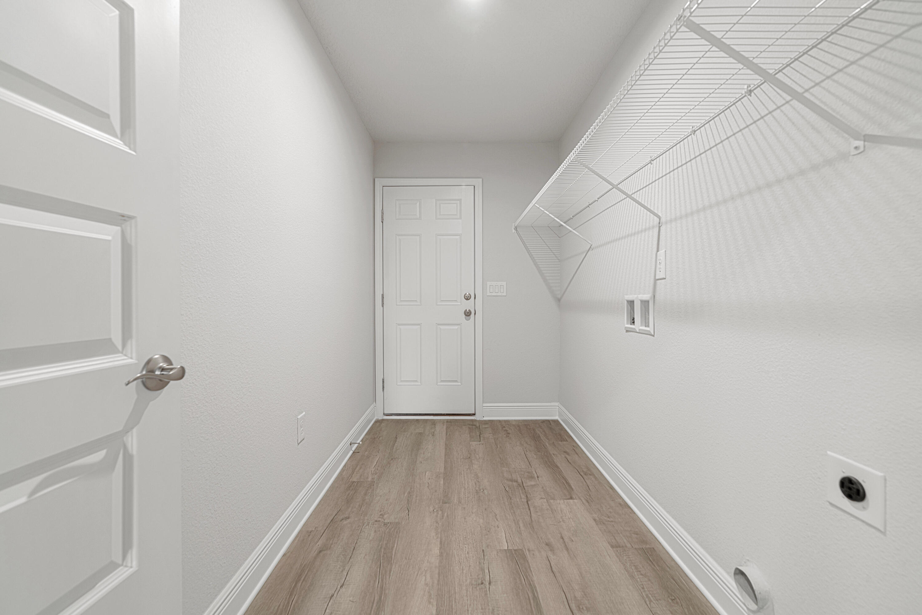 2004 Broad Street Crestview, FL 32536 - Photo 27 of 46 a view of a room with wooden floor and white walls