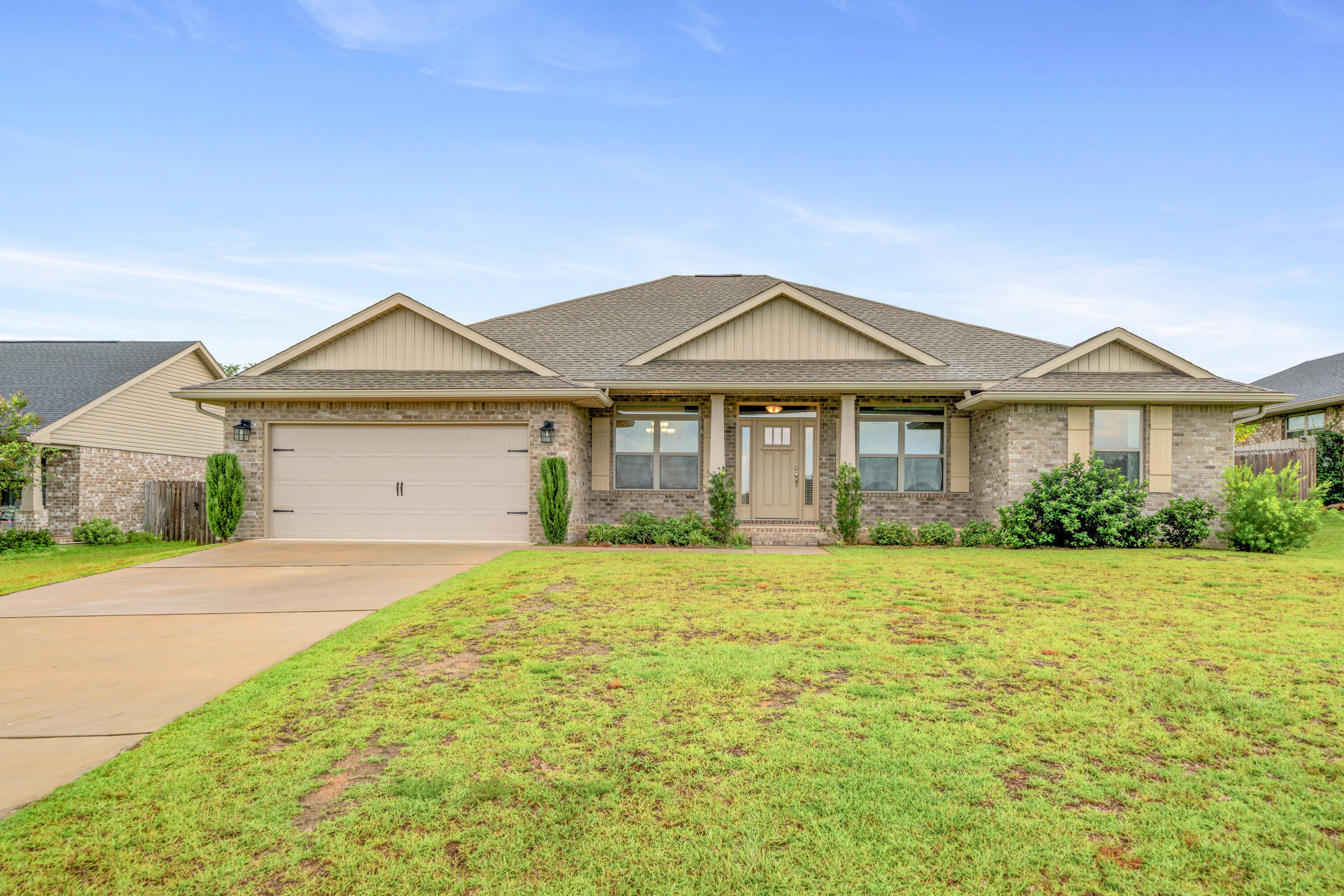 2004 Broad Street Crestview, FL 32536 - Photo 4 of 46 a front view of a house with a garden