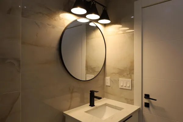 a bathroom with a sink and a mirror