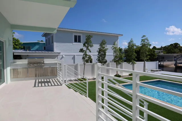 a view of a balcony with chairs